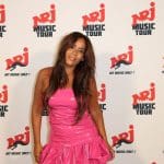 Amel Bent, enceinte, défile pour une jeune créatrice pointue